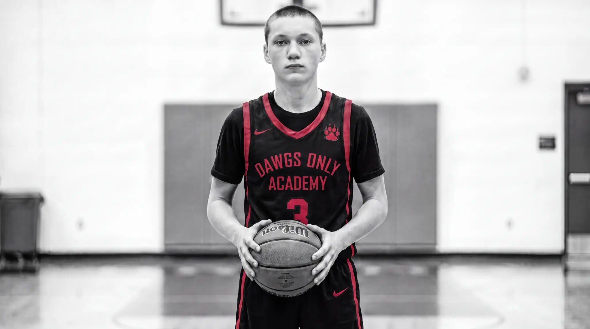 DAWGS ONLY athlete wearing number 3 and holding a basketball